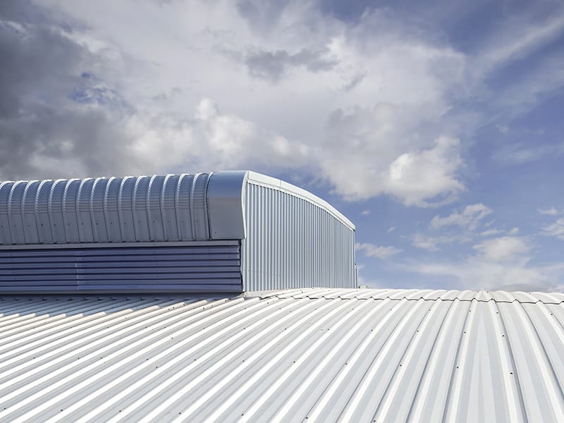 Metal angled roof with sky on the background